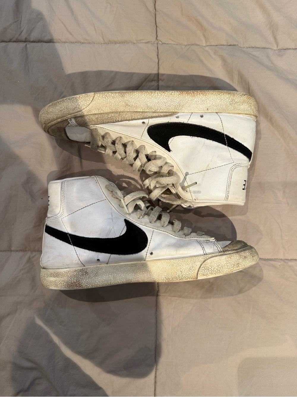 Nike White High-Top Sneakers with Black Swoosh